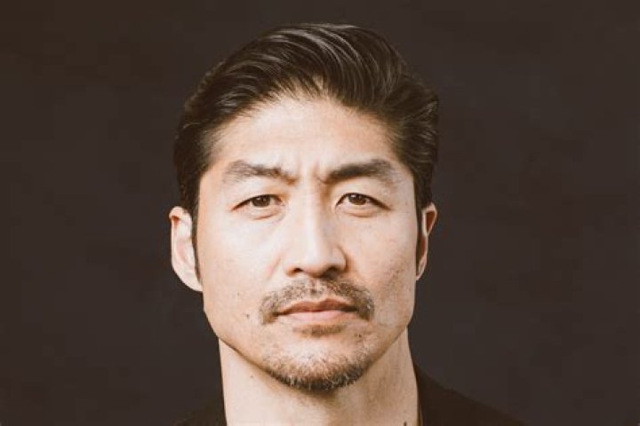 How tall is Brian Tee